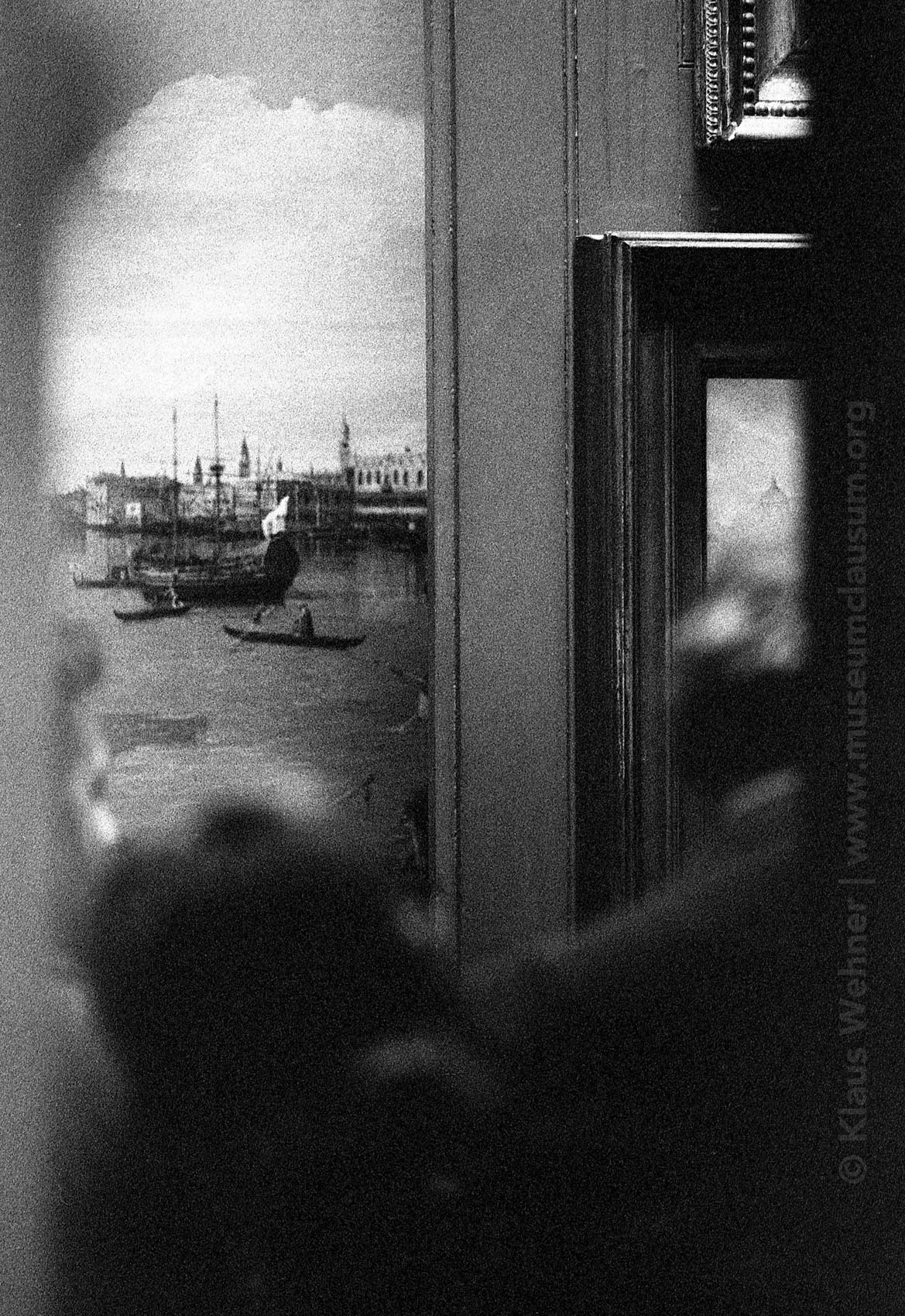 Sir John Soane's Museum: Black and white, blurred crop of a view into the Picture Room showing the back silhouettes of visitors.